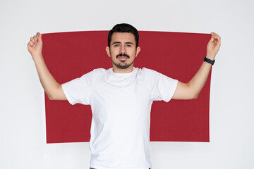 Moustached man holding Morocco flag, campaigning concept, patriot and nationalist person, protest 