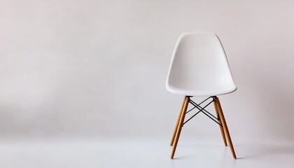 Poster - White Chair on a White Background.
