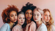 © Alina Tymofieieva - A group of five women of various ethnic backgrounds stands close together, sharing smiles against a pastel-colored backdrop.