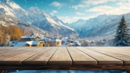 Wall Mural - A wooden table in front of a snowy mountain landscape, evoking a cozy winter atmosphere.