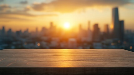 Canvas Print - A wooden table in the foreground with a city skyline and sunset in the background.