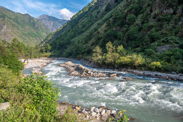 Wall Mural - View of Langtang Khola river a river coming from the south flows down along the Langtang trekking route, Nepal. 