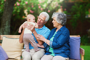 Poster - Outdoor, baby and grandfather with grandmother, playful and bonding together with happiness. Backyard, family and generations with love, joy and smile with nature, weekend break and cheerful in park