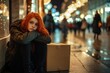 © Kenny - Redheaded woman with cardboard box on city street at night