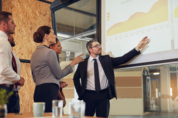 Poster - Boardroom, analysis and group in meeting, monitor and controller with financial report and teamwork. Business, speaker and people in office, listening and discussion of sales and presentation