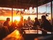 © Raweewit - Group of friends enjoying a sunset view in a modern bar, creating memorable moments against a city skyline.