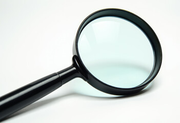 A magnifying glass with a black handle.