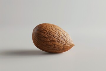A single walnut shell on a white surface