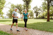 © Maria Vitkovska - Happy, active senior couple walking and talking in the park together, love, relationship concept