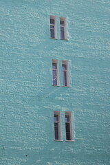 windows on a blue wall, facade of a high-rise residential building, 2