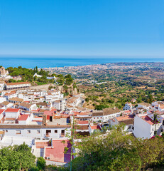 Wall Mural - Mountain, city and travel with buildings, nature and Mijas with tourism, Andalusia and Spain. Empty, outdoor and luxury home for summer holiday, destination or vacation with architecture or landscape