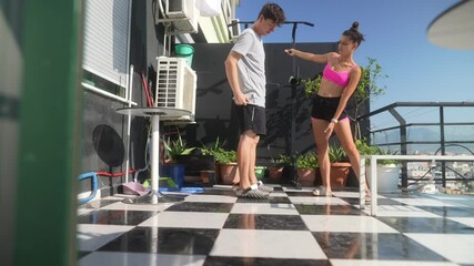 Wall Mural - Enjoying Fitness Training on a Sunny and Inviting Balcony While Embracing Nature and Community