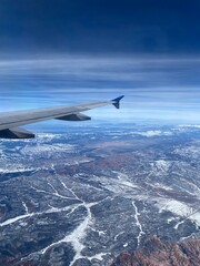 airplane wing over landscape