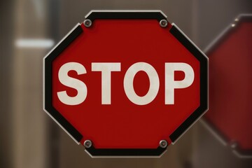 A red octagonal stop sign with white lettering.