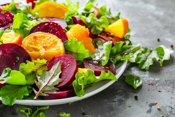 A fresh, colorful salad of leafy greens, beets, and oranges, artfully presented on a white plate, showcasing a mix of textures and vibrant, appetizing colors.