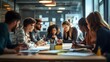 © sungedi - A group of young people are working together at a table in an office.