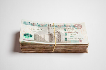 Egyptian money papers of currency 100 pound isolated in white Background