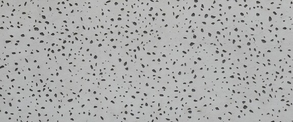 Wall Mural -  close-up view of a concrete surface with a speckled texture