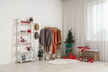 Canvas Print - Interior of hallway with Christmas trees, clothes rack and shelf unit