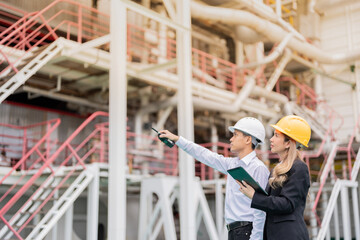 Wall Mural - The power industry thrives on the collaboration of diverse teams of men and women engineers who work together to improve energy efficiency and sustainability for a brighter future.