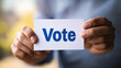 © golf - Hands Holding Vote Card