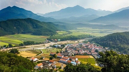 Canvas Print - Aerial View of a Village Nestled in a Mountain Valley