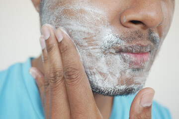 young Man washing cleaning face,