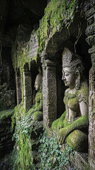 Wall Mural - Ancient underground temple complex with crumbling stone statues covered in moss and greenery, showcasing intricate carvings and serene atmosphere