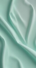 Canvas Print - A close-up view of a soft, mint green fabric, with a smooth, flowing texture that creates a sense of movement and softness.