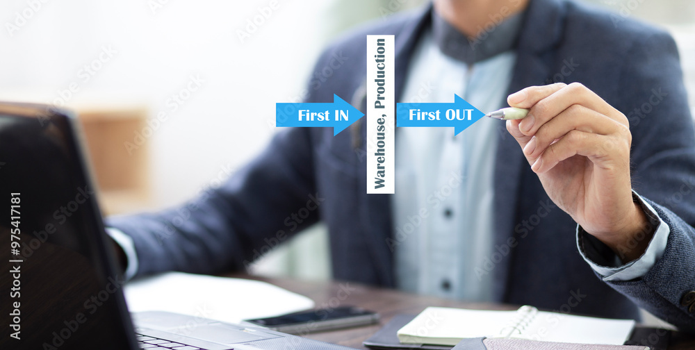 First in First out management system concept , Businessman drawing arrow first in and first out for management in warehouse and production