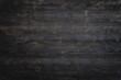 © Phushutter - Rustic, dark wood surface aged texture showcases intricate grain patterns. Charred and weathered, planks reveal vintage, earthy warmth, creating natural, organic feel reminiscent of firewood.