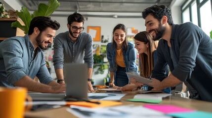 Wall Mural - Group of four professionals collaborating over a laptop and documents