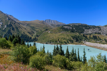 Wall Mural - Beautiful mountain lake, forest and mountains. Big Almaty lake in summer time. Mountain landscape in Kazakhstan.