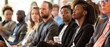 © Ai Studio - A diverse group of professionals in business attire attentively listens to a presentation at a conference, highlighting focus and engagement.