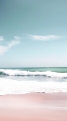 Wall Mural - Peaceful beach with gentle waves and a pink sandy shore.