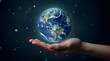 © Patrick Helmholz - Hand holding planet Earth against a starry space background