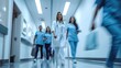 © Ruslan Gilmanshin - Doctors or nurses walking in hospital hallway, blurred motion