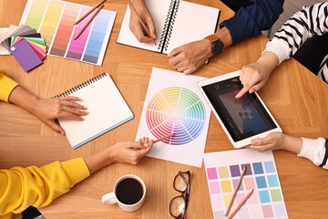 Wall Mural - Group of designers working together at table, closeup