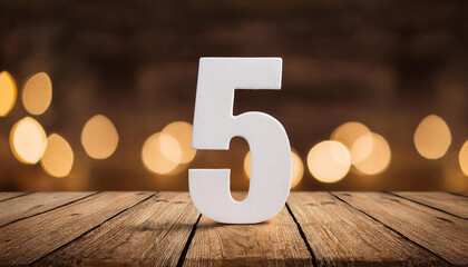 Fototapete - White number 5 five on wooden background, bokeh with golden lights. Holiday and celebration