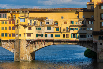 View of the famous Ponte Vecchio over the Arno river in the city of Florence in Italy.