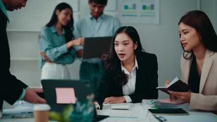 Sticker - Businesswomen engaging in a productive discussion during an office meeting. Collaboration on a project fosters teamwork and innovative ideas among the group