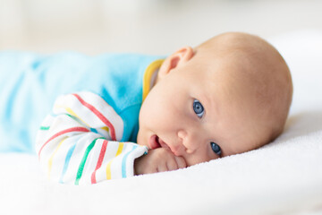 Wall Mural - little baby on white bed