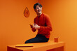 © Jacob Lund - Successful marketing professional using smartphone in vibrant monochromatic office setup