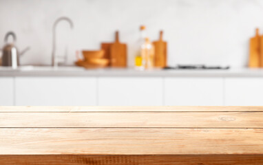 wooden table close up, against wall with warm sunset light from window, table for advertising display your products.