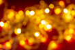 © Serhii - Bright festive orange blurred background with bokeh
