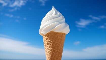 Wall Mural - delicious soft serve vanilla ice cream cone against a vibrant blue sky perfect treat for sunny days