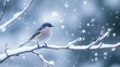 © arthit - A small bird perched on a snow-covered branch, with snow gently falling in the background.