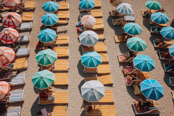 Wall Mural - Aerial view of sandy beach with colorful umbrellas in summer. Top view