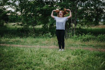 Happy woman with long hair smiling in a lush green park. She feels free and joyful in the natural surroundings.