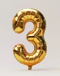 © Maryam - A shiny golden balloon in the shape of the number three